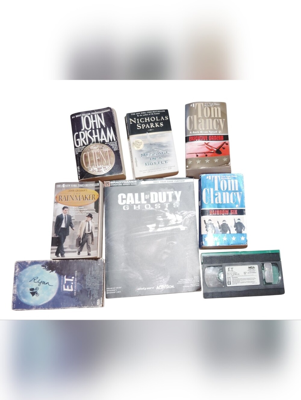 John Grisham, Tom Clancy, Nicholas Sparks, Call Of Duty Books And E.T. Vhs Lot